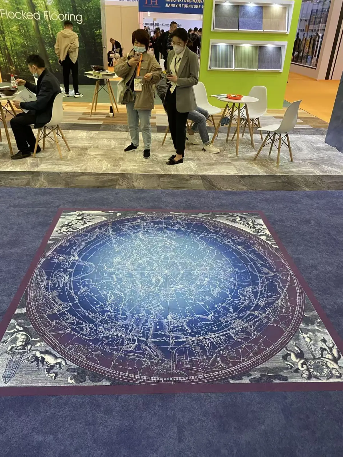 A finely detailed celestial chart printed on flocked flooring at exhibition scale